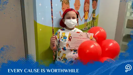 A brave young boy smiling with hope in his eyes after surviving a severe leukemia relapse and undergoing a successful bone marrow transplant.