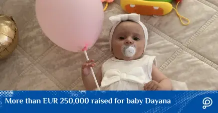 A touching photo of little Dayana, a young girl bravely fighting a 10cm tumor, looking ahead with hope during her hospital admission.