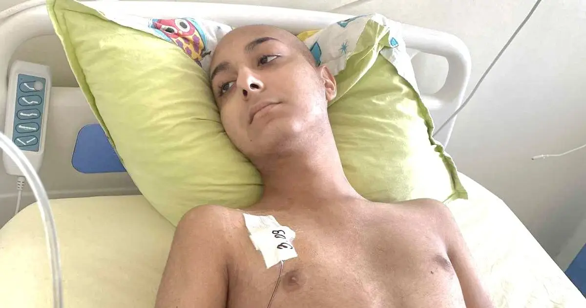 Yordan lies in a hospital bed during treatment for a rare form of leukemia at a specialist hospital abroad.